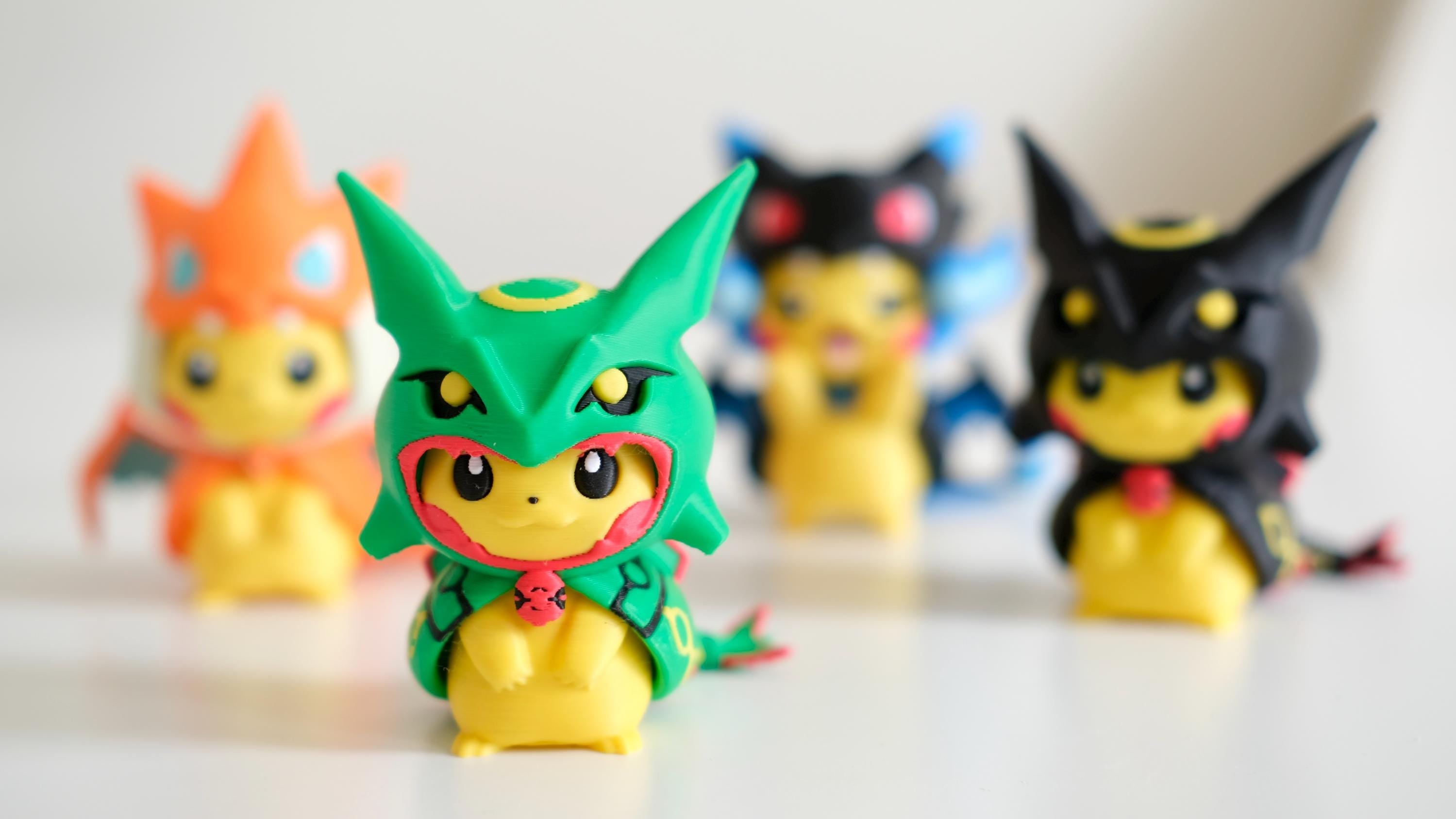 Poncho Pika Figure: Rayquaza, Charizard, Magikarp, Gengar
