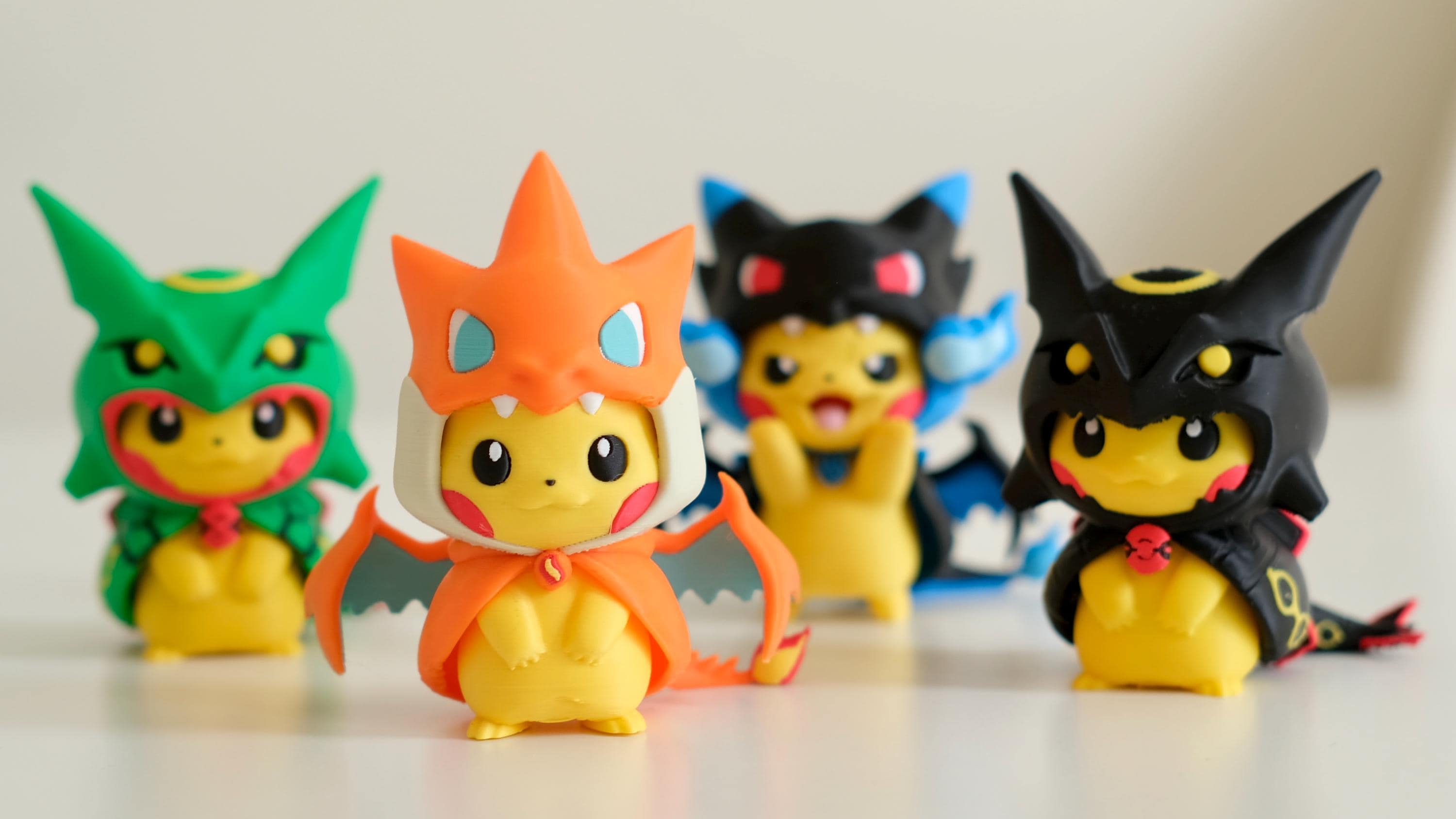 Poncho Pika Figure: Rayquaza, Charizard, Magikarp, Gengar
